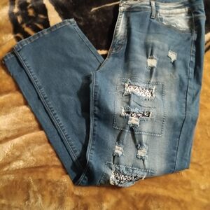 Stylish Blue Distressed Women Jeans With Black And White Patches.  Never Worn.